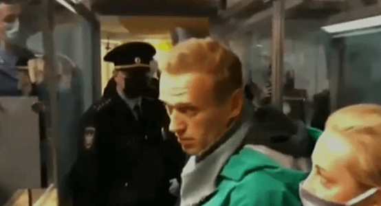 Alexei Navalny detained at airport on return to Russia